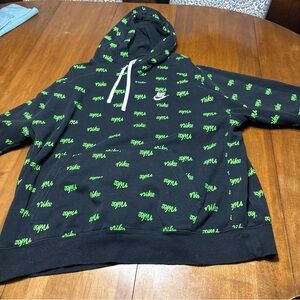 Nike Men's Black Hoodie with Green Logo Pattern